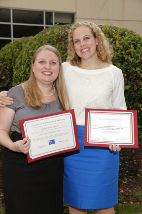 Keck School of Medicine honorees Kayla Dewey and Caitlin Carroll display their awards after the May 16 ceremony. 