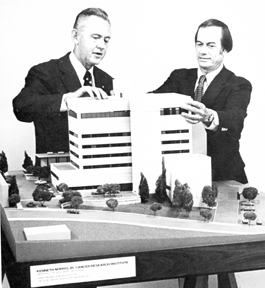 Right, donor Kenneth T. Norris Jr. (left) and Denman Hammond, founding director of the center, display the first architechtural model of the new facility in a late 1970s file photo.
