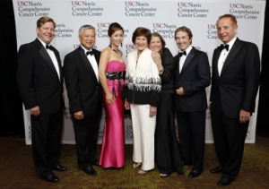 USC Norris presented the Founders Award to the Kenneth T. and Eileen L. Norris Foundation, and the Visionary Award to alumnus and supporter Ming Hsieh and his wife Eva. Left to right: Stephen Gruber; Ming and Eva Hsieh; Harlyne Norris and Lisa Hansen of the Norris Foundation; actor Martin Short; and Keck School Dean Carmen A. Puliafito. (Photo/Steve Cohn)