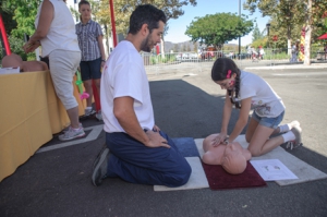 Hands-on cardiopulmonary resuscitation (CPR) training for adults and children was among the many offerings for the community  at the Sept. 28 event. (Photo/Paul Edward Robison)