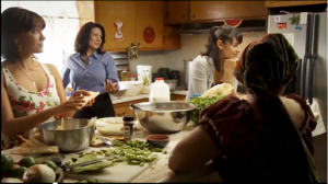 In this screen capture from the short film Tamale Lesson, the fictional Romeo family discusses cervical cancer screening while making tamales for a Quinceanera.