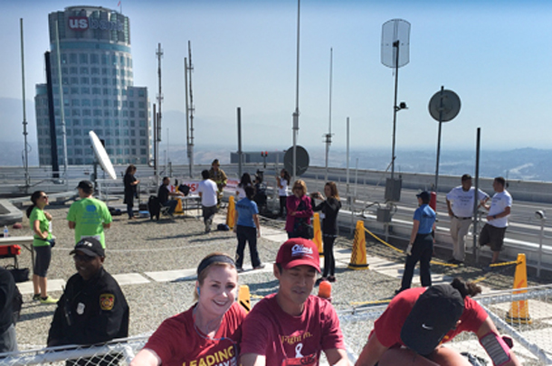 Two of the team’s top fund-raisers — physicians Alison Wilcox, left, and Christopher Lee — atop the Aon Center.