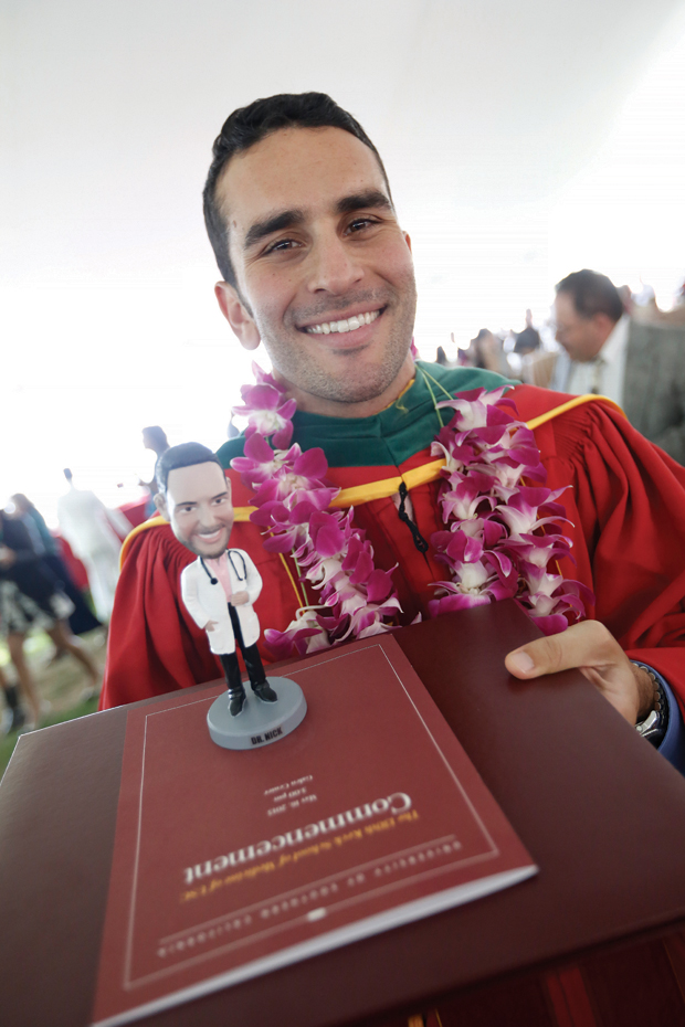 MD graduate Nick Saade shows off his “Dr. Nick” statuette