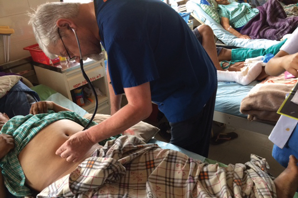 Ed Newton, MD, examines a patient in Kathmandu.