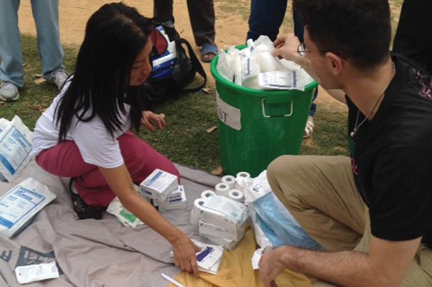 Ramona Paolim and Shihab Sugeir sort through supplies the team brought to Gorkha in Nepal from the Keck School and L.A. County + USC Medical Center.