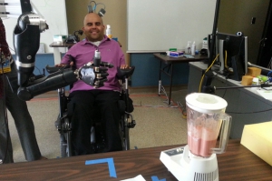 Erik Sorto uses a robotic arm to operate a blender and make a smoothie just by thinking about it. 