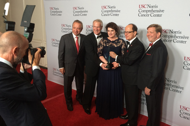 Keck School Dean Carmen A. Puliafito joins David and Dana Dornsife on the red carpet with USC President C. L. Max Nikias and USC Norris Director Stephen B. Gruber.