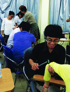 Cambodian medical students practice with some of the equipment delivered by members of the Keck School of Medicine of USC neurology team in July 2015. A group of medical professionals from the Keck School are developing a neurology outreach program for Cambodian health care professionals funded by a grant from the World Federation of Neurology.