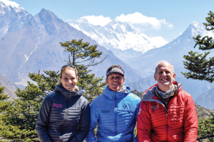 From left, Vanessa Blasic, Everest guide Bill Allen and Greg Blasic are seen while trekking to Base Camp, with Mount Everest in the background.