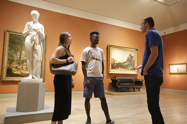 Keck School of Medicine of USC students walk through an art gallery during the Welcome Reception for first-year and returning students, held Aug. 9 at Huntington Library and Gardens.