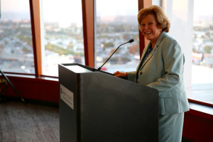 Judith D. Tamkin welcomes guests to the first annual USC Judith D. Tamkin International Symposium on Elder Abuse held in Los Angeles on September 15 and 16. (Photo/Claire Norman)