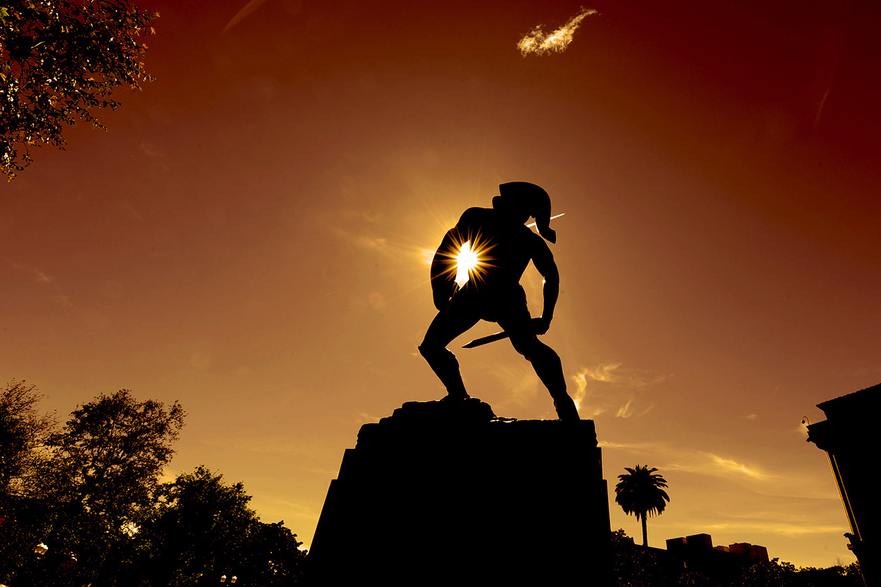 Tommy Trojan is seen at sunset