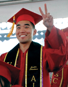 USC School of Pharmacy graduate Justin Shintani flashes a victory sign at the school’s May 17 commencement ceremony. Photo/Jon Nalick