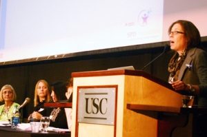 Sarah Schoen (right), PhD, associate director of research at the Sensory Processing Disorder Foundation in Greenwood Village, Colo., presents her research at the 2013 USC Occupational Science Symposium. (Photo/Clarissa Tu)