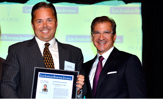 Scott Evans accepts his award from Matthew Toledo, publisher and CEO of the Los Angeles Business Journal. (Photo courtesy LA Business Journal)