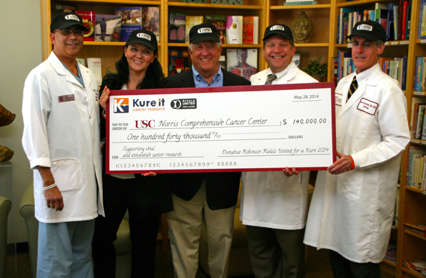 From left are: Uttam K. Sinha, associate dean, Surgical Simulation; Agnieszka Kobielak, assistant professor of Otolaryngology-Head & Neck Surgery and biochemistry and molecular biology;  Barry Hoeven, founder of Kure It Cancer Research;  Stephen B. Gruber, director of the USC Norris Comprehensive Cancer Center; and  Kevin McDonnell, clinical instructor at the Keck School of Medicine of USC. (Photo/Jon Nalick)