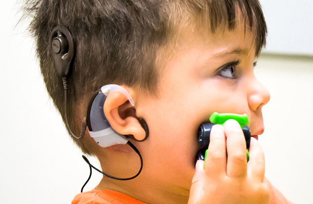 Auguste Majkowski, 3, wears the auditory brainstem implant that Keck Medicine of USC researchers are studying in an NIH-funded clinical trial. (Photo courtesy CHLA)