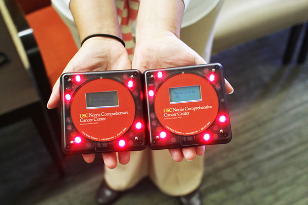The pagers light up and gently vibrate to notify patients when their clinician is ready to see them.
