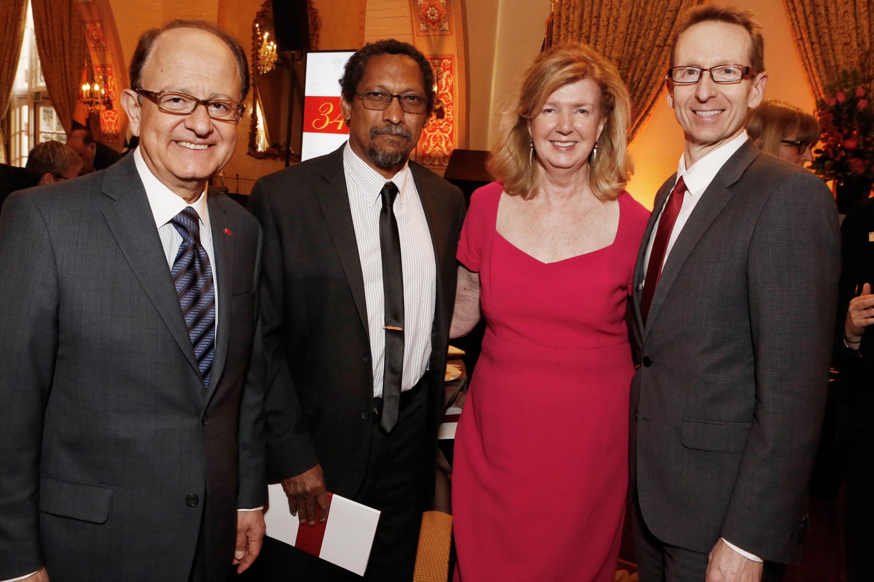 C. L. Max Nikias, left, and Michael Quick, right, flank 2015 Presidential Medallion honorees Percival Everett and Roberta Williams.