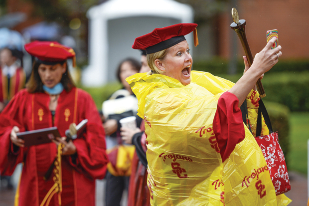 Selfies and rain gear were common, as Occupational  Science/ Occupational Therapy faculty marshal Sarah Bream shows. 