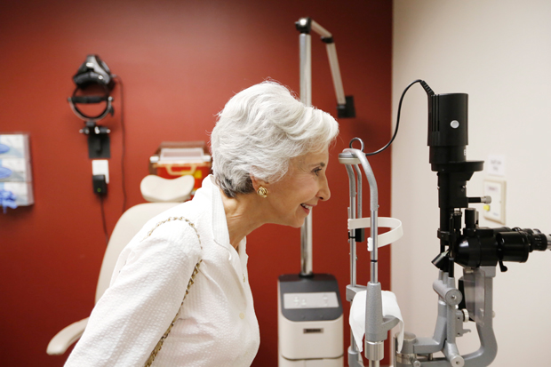 Jill Petty examines some of the equipment during a tour of the USC Eye Institute facility in Beverly Hills.
