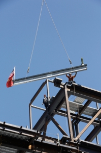 After it was signed by Keck Medicine of USC patients and staff, the last steel beam was placed atop the building under construction.