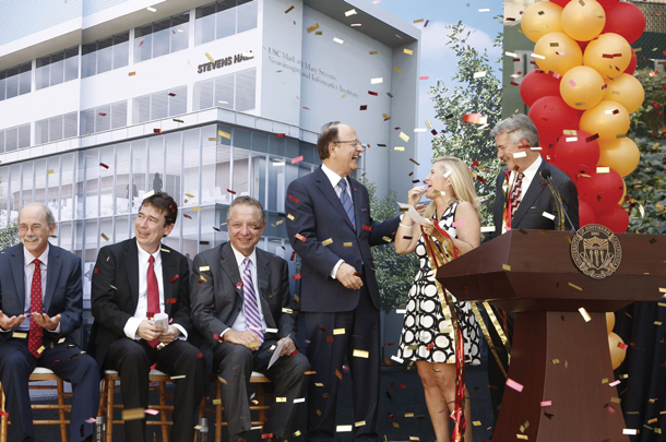 USC President C. L. Max Nikias shares a laugh with Mary and Mark Stevens. Seated nearby are Arthur Toga and Paul Thompson, plus Keck School of Medicine Dean Carmen A. Puliafito.