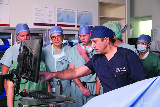 Inderbir Gill, front, points to a screen during a noninvasive high intensity focused ultrasound procedure on Dec. 10.