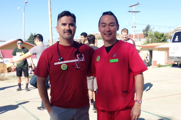 John Rodarte, MD, left, stands with second-year medical student Jeremiah Wang during the November volunteer trip to the Healing Hearts Across Borders clinic in Tijuana, Mexico.
