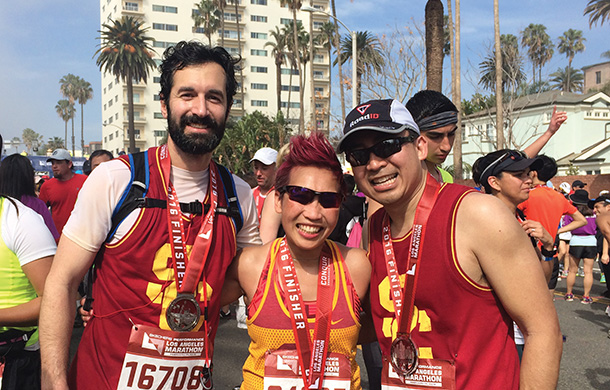 From left, Jonathan Russin, MD, stands at the finish line of the 2016 Skechers Performance Los Angeles Marathon with former patient Kathy Nguyen and her husband, Robby.