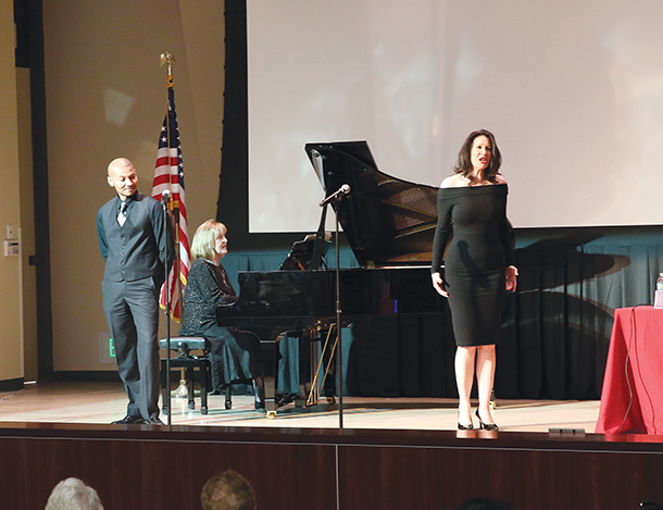 Award-winning bass-baritone Cedric Berry, left, looks at soprano Lisa Eden as she sings during a performance of La Ci Darem La Mano by Mozart, with piano accompaniment by Zora Mihailovich, at a Visions and Voices event titled, 