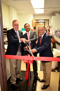 From left, Michael Selsted, Rohit Varma and Narsing Rao cut a ribbon during the grand opening of the Ophthalmic Molecular and Immuno-Pathology Lab at the USC Gayle and Edward Roski Eye Institute, April 8 on the Health Sciences Campus.