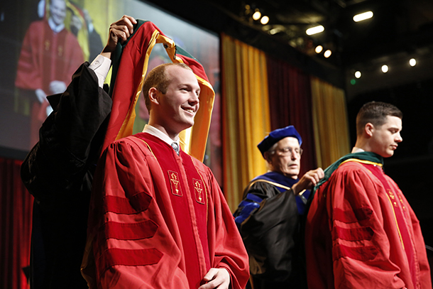 Hoods are placed on graduating medical students during the Keck School of Medicine of USC MD/PhD and MD commencement ceremony May 14, 2016 at the Galen Center.