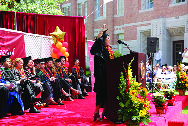 Class speaker Yeliana Mayor raises her hand in celebration during the satellite commencement ceremony for the Primary Care Physician Assistant Program on May 13, 2016 at the University Park Campus.