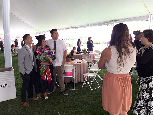 Ashley Alfonso, a Keck School of Medicine of USC master of public health graduate, takes photos with family members during a commencement reception May 14, 2016 at McCarthy Quad on the University Park Campus.