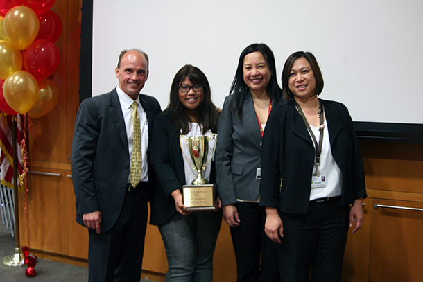 Nerwin Lin, Jynette Querubin and Christine Santiago from the Quality and Outcomes department stand with Rod Hanners, left, after placing first in the R3 Innovation Challenge, held May 16.