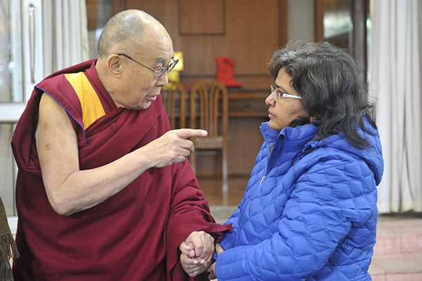 Soma Sahai-Srivastava, right, shakes hands with the Dalai Lama during a January visit to Dharamsala, India.