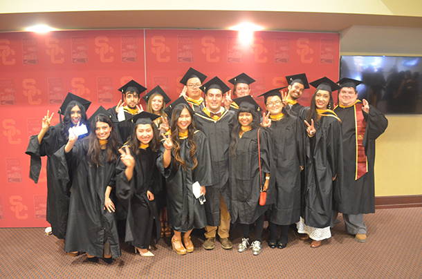 Members of the inaugural Master of Neuroimaging and Informatics class show their Victory signs before the PhD, MPH and Master's degree satellite commencement ceremony for the Keck School of Medicine of USC, held May 14 at the Galen Center.