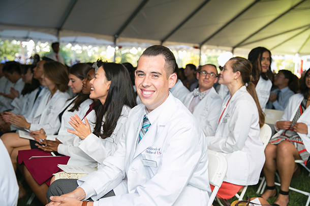First-year students, family and faculty attend the 2016 white coat ceremony Aug. 12 on the Broad Lawn at the Health Sciences Campus.