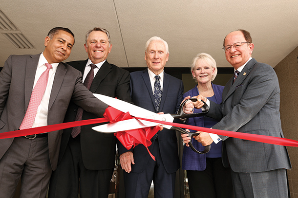 From left, Keck School of Medicine of USC Interim Dean Rohit Varma, USC Board of Trustees Chairman John Mork, philanthropists Malcolm and Barbara Currie, and USC President C. L. Max Nikias are seen during a ribbon-cutting ceremony for the Malcolm and Barbara Currie Residence Hall, held Aug. 25 on the Health Sciences Campus. 