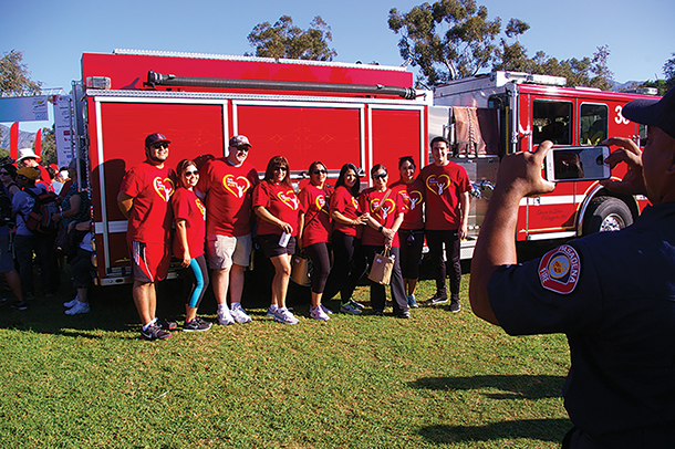 Participants pose for a photograph during the 2015 Los Angeles Heart Walk at the Rose Bowl in Pasadena.
