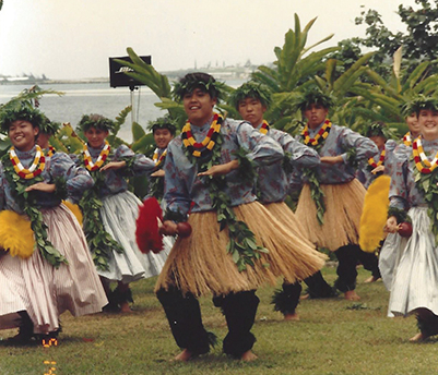 In addition to playing several instruments, Justin Ichida dances the hula, seen here in 1994.