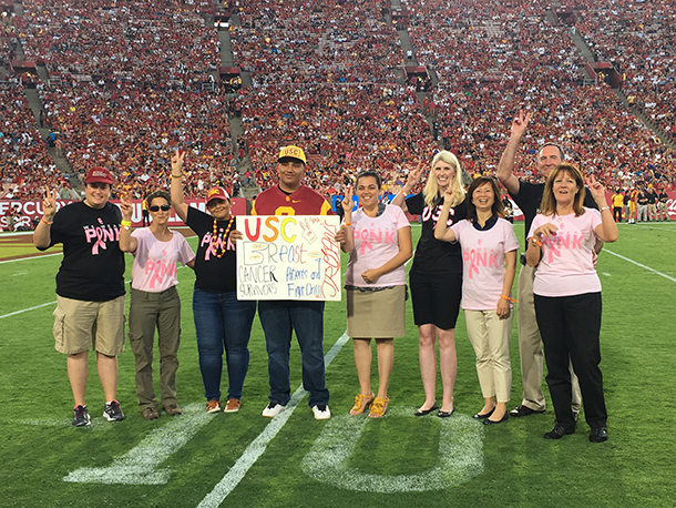 From left, Julie Lang, Laurie Feinstein, Mincin Golchini and her son Keivan, Bodour Salhia, Maria Nelson, Janice Lu, Stephen Sener and Christy Russell are seen Oct. 1 at the Los Angeles Memorial Coliseum.