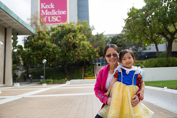 Lulu Wang, left, participates in the Halloween parade Oct. 31 on the Health Sciences Campus, with Grace, dressed as Snow White.
