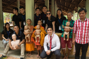In addition to training government officials and providing free health checks for villagers, Michael Pham, front center, and his team certified more than 80 first responders in Cambodia. (Photo/Courtesy The CPR Hero LLC)