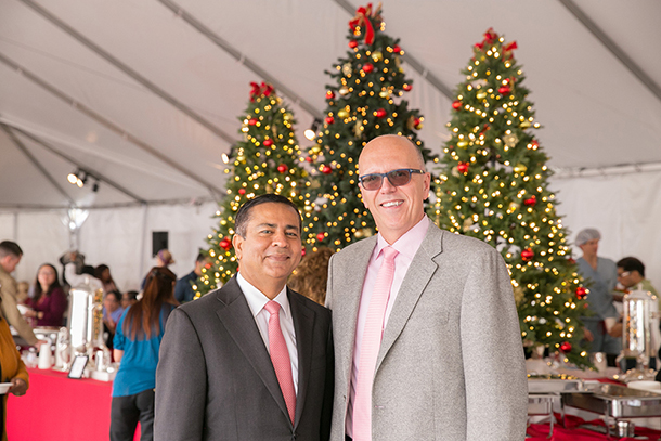Rohit Varma, left, and Tom Jackiewicz smile during the Holiday Luncheon, held Dec. 15 on the Health Sciences Campus.
