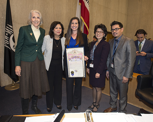 Kate Wilber, PhD, Supervisor Hilda Solis, Allyson Young, Belle Chen and Richard Franco stand with the scroll presented to the Los Angeles County Elder Abuse Forensic Center at the Board of Supervisors Meeting on Dec. 6, 2016. 