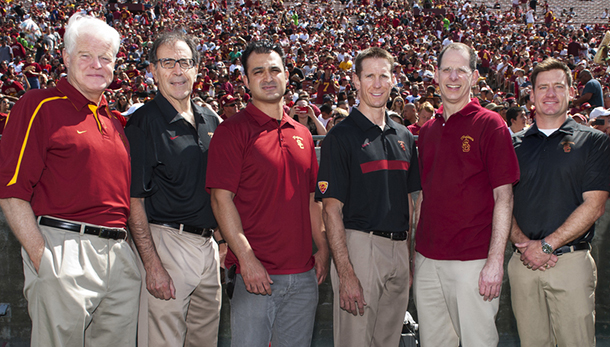 From left, C. Thomas Vangsness, James Tibone, Reza Omid, George Hatch, Jay Lieberman and Seth Gamradt are seen at the Los Angeles Memorial Coliseum. The physicians, joined by Alex Weber, are the official doctors of USC Trojan athletes.