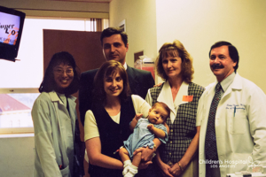 Lydia Hand as an infant post-transplant in 1998, with her mother, grandmother and liver transplant team.