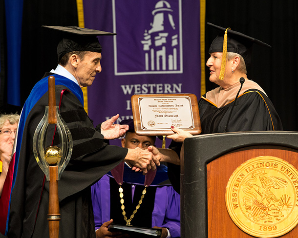 Frank Stanczyk receives an alumni achievement award from Western Illinois University on Dec. 17.